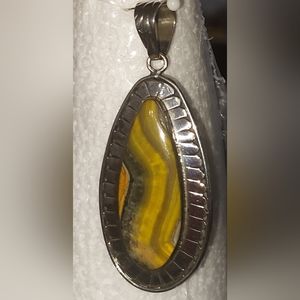 Bumble Bee Jasper wrapped in a Sterling Silver frame.